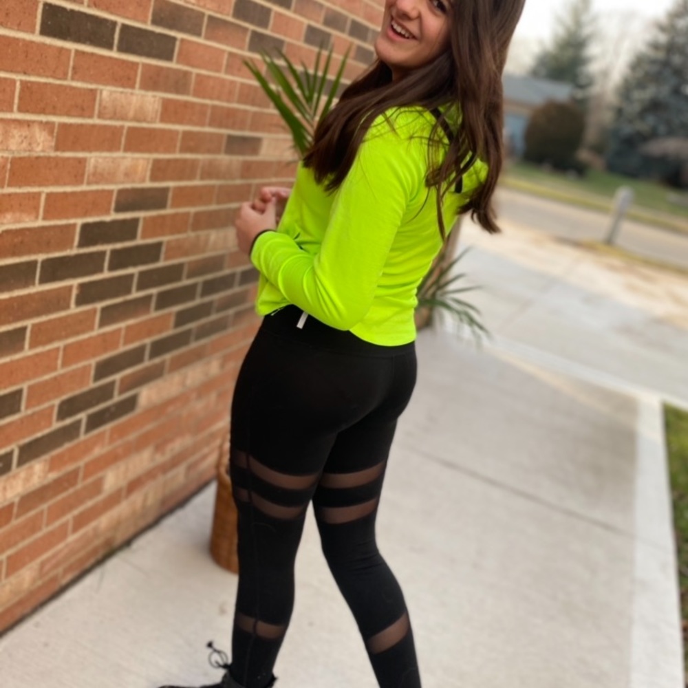 Black athletic leggings with mesh design
